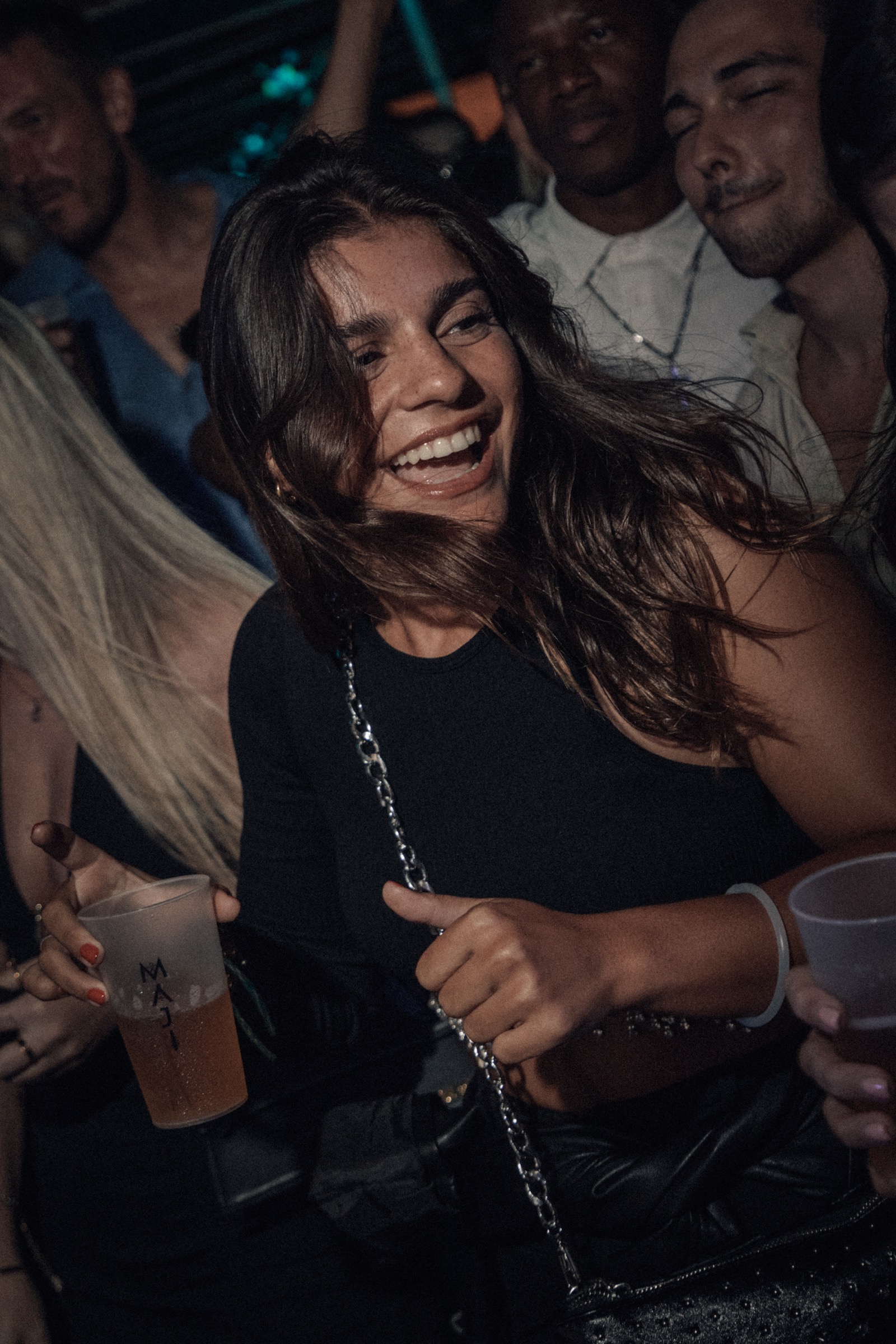 Crowd dancing at an open air music event in Portugal by MAJI